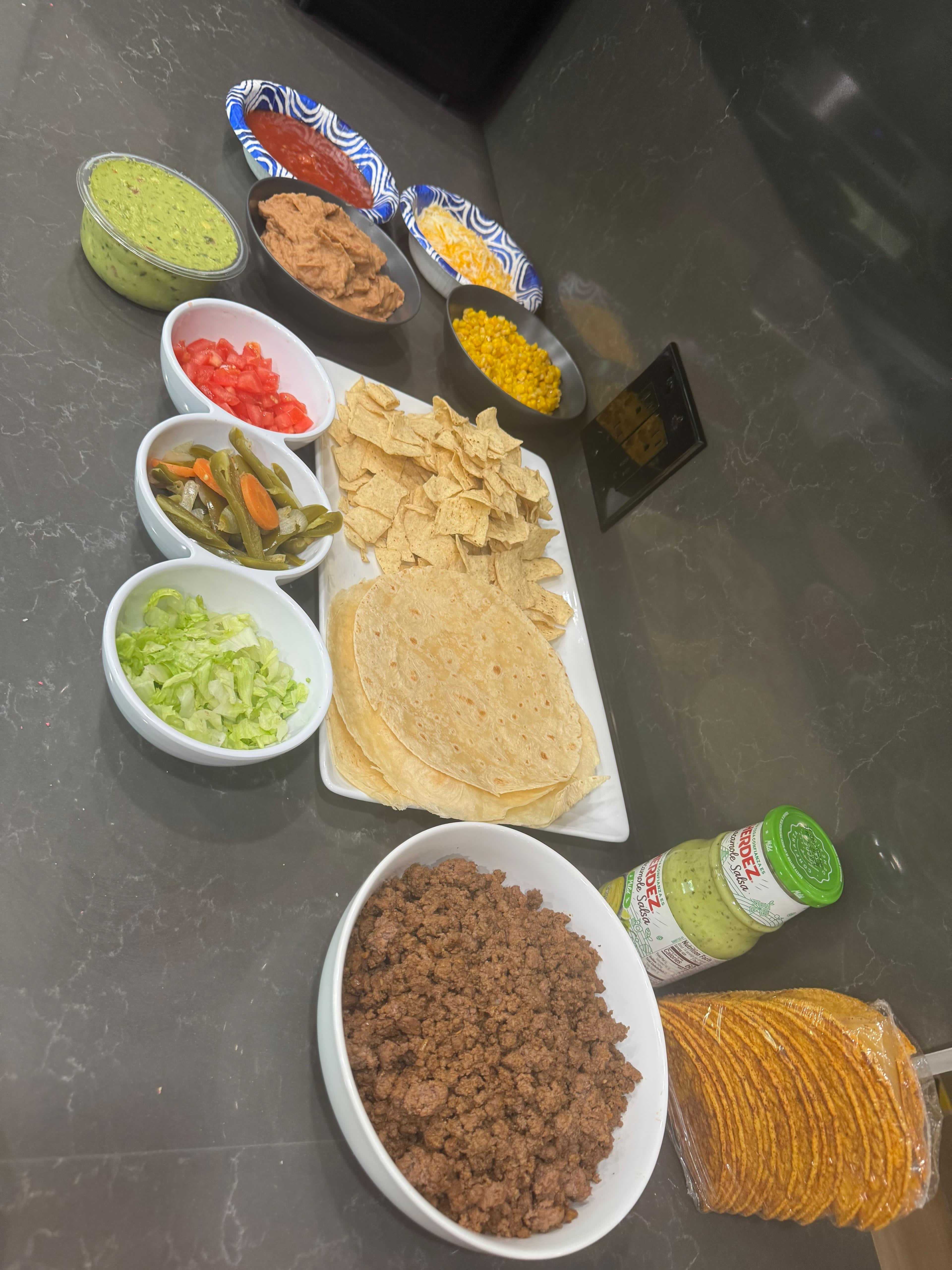 Taco bar with fresh ingredients for a shared meal at LA Wellness Haven